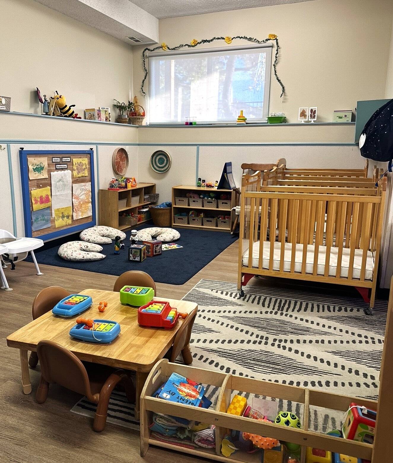 Indoor child care room at BrightPath Whitehorn, brightly lit and filled with age-appropriate learning materials and toys