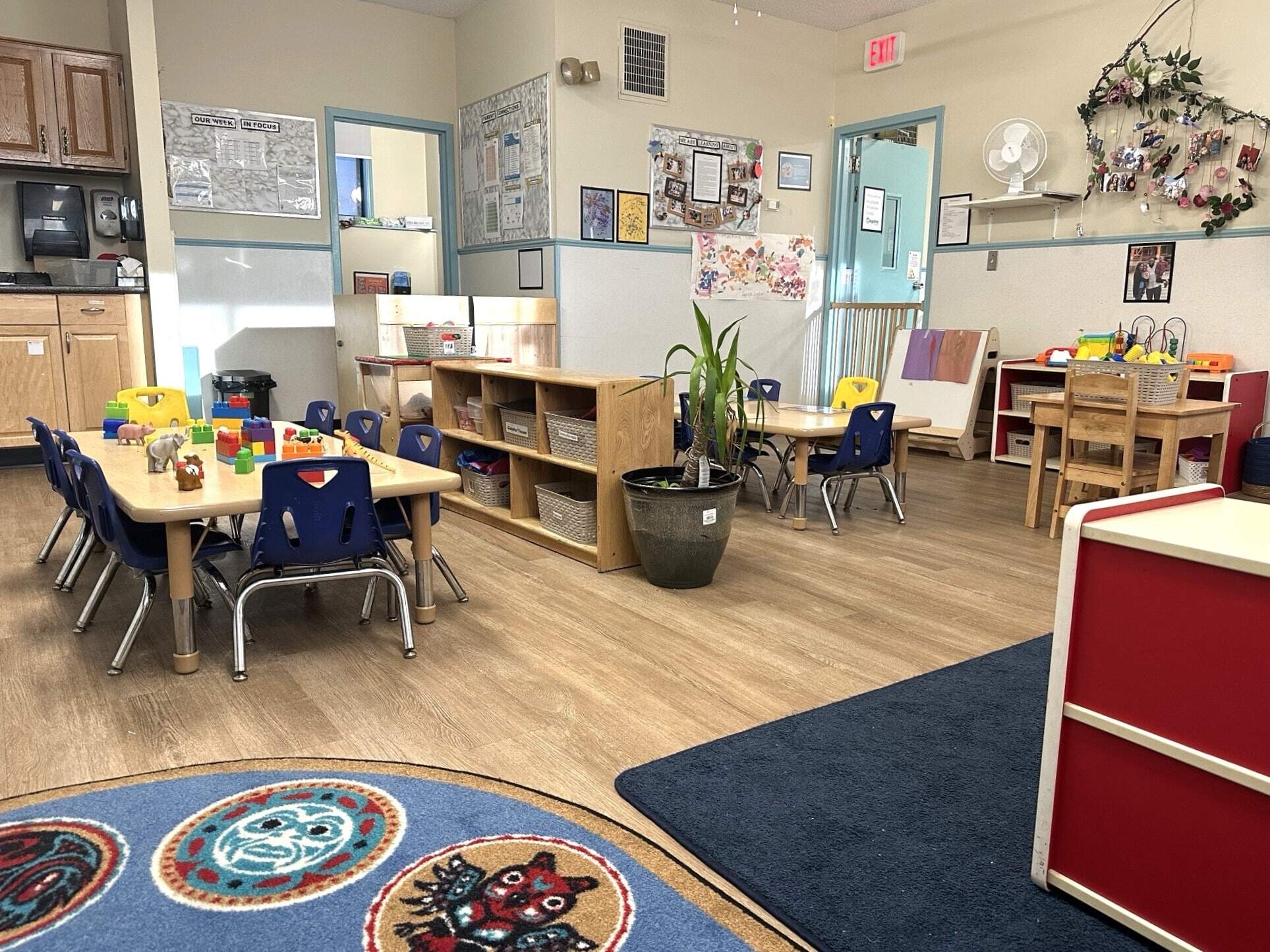 An educator at BrightPath Whitehorn discussing with a parent, offering advice and support on parenting questions, illustrating the center's commitment to family engagement.