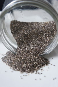 Chia Seeds poured out of a jar