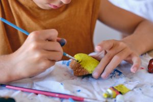Painting rocks is a fun gardening activity for kids
