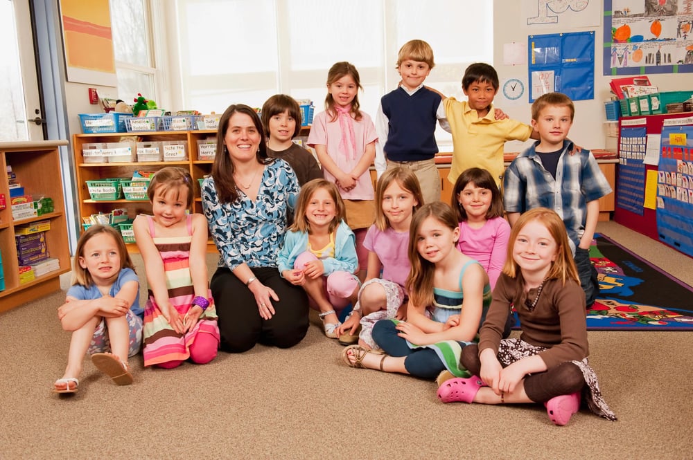 portrait-of-teacher-and-children-2023-11-27-05-08-36-utc