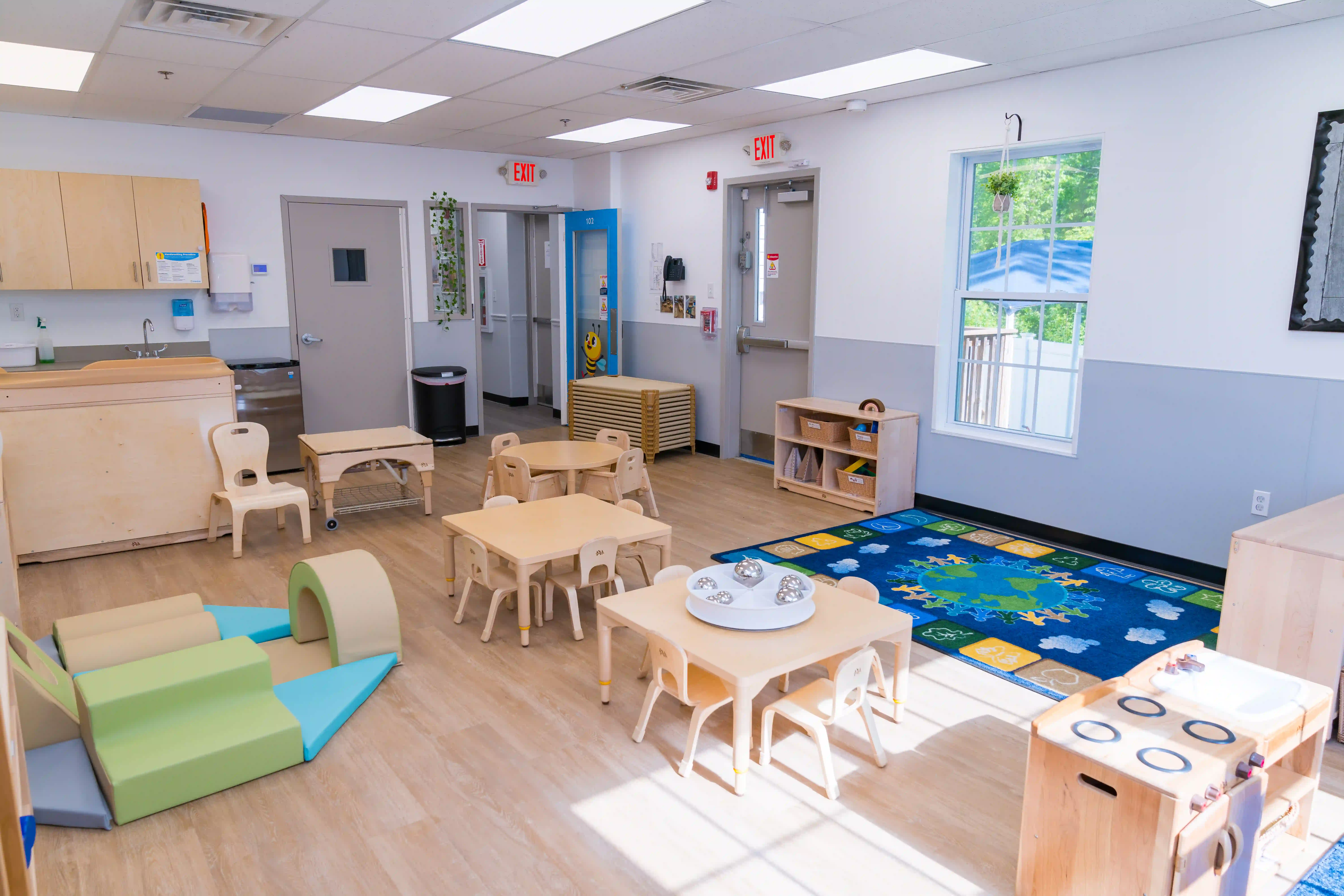 A cozy reading nook inside BrightPath Child Care Center, illustrating the center's commitment to cognitive development.
