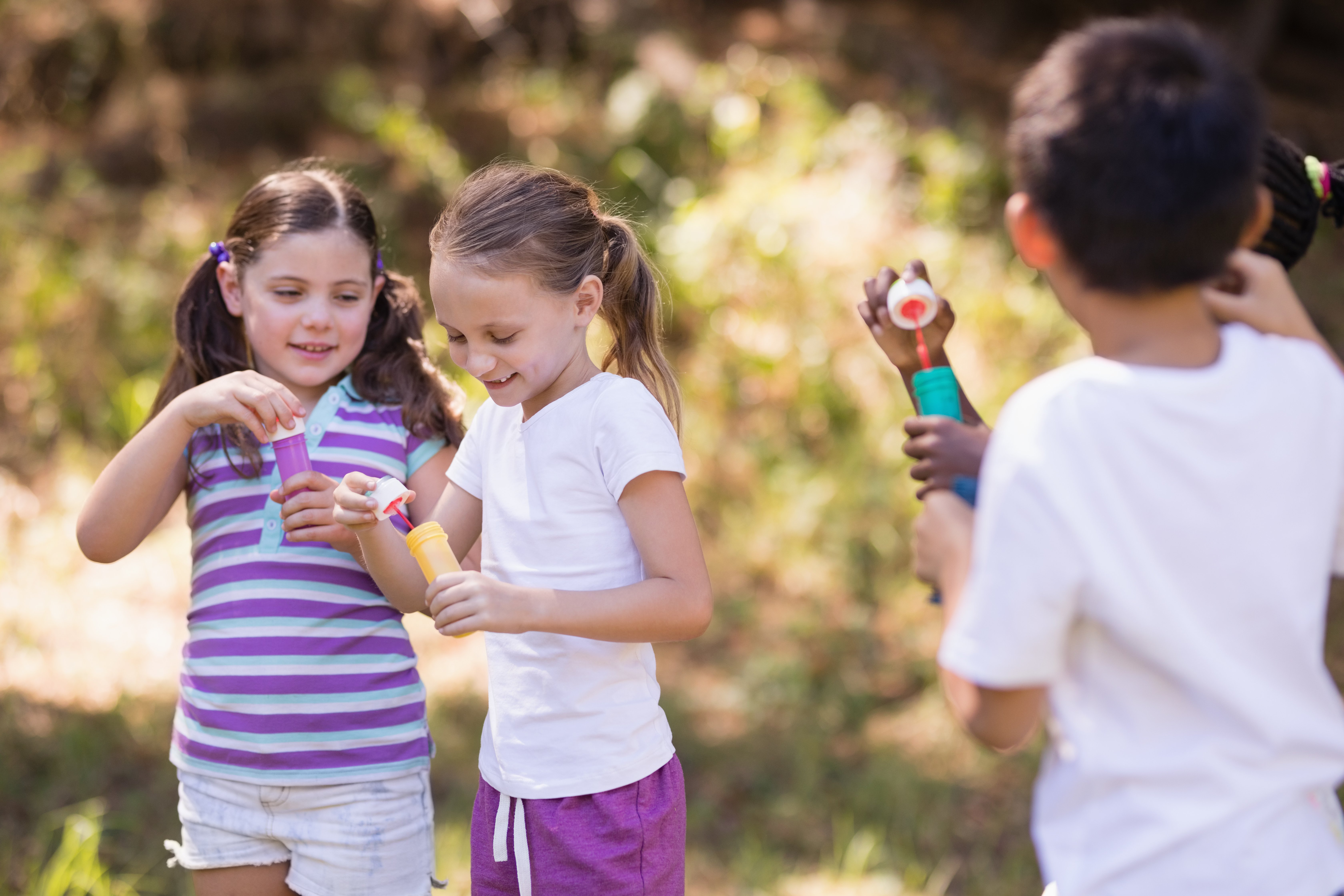 kids playing outside together in summer 