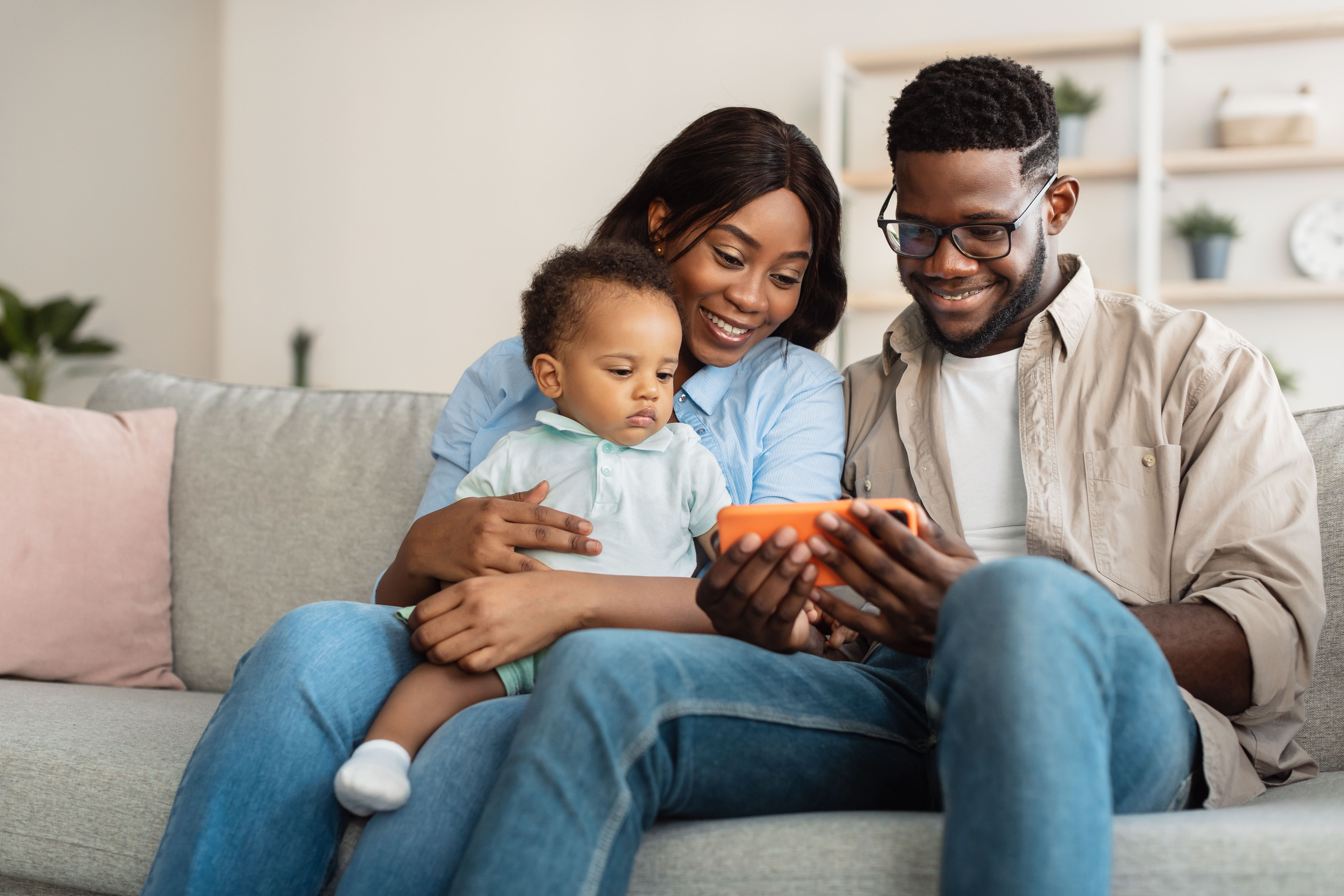 A family learning more about the BP Connect app for their child in daycare 