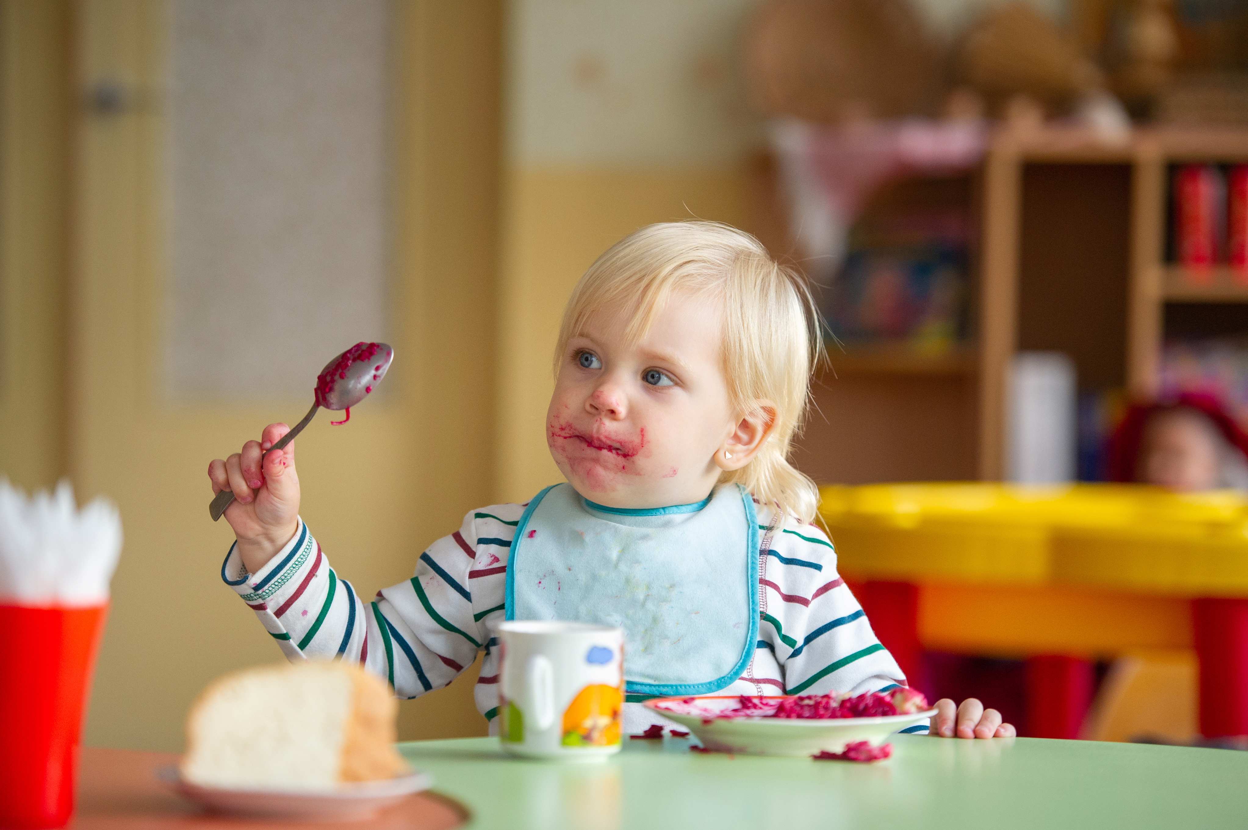 child trying new food